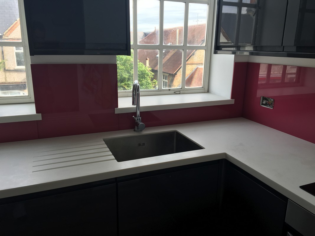 Deep plum coloured glass splashback in modern Hanwell kitchen